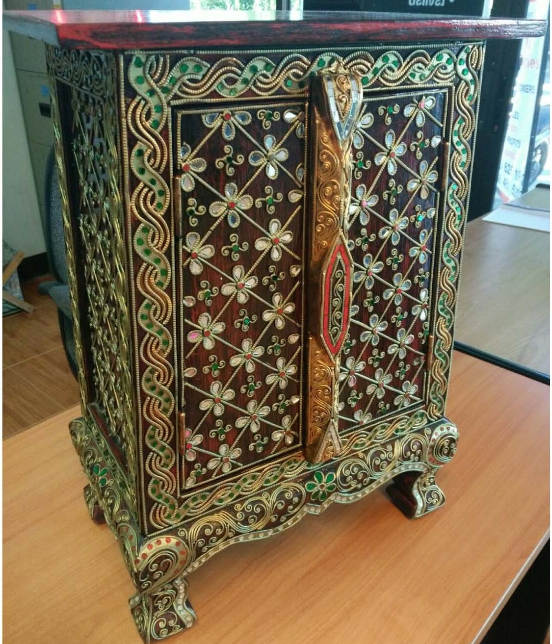 Thai patterned cabinet decorated with glass
